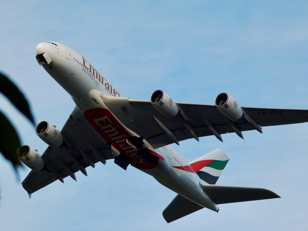 pexels-photo-28363150-28363150 Low angle view of Emirates Airbus A380 ascending.